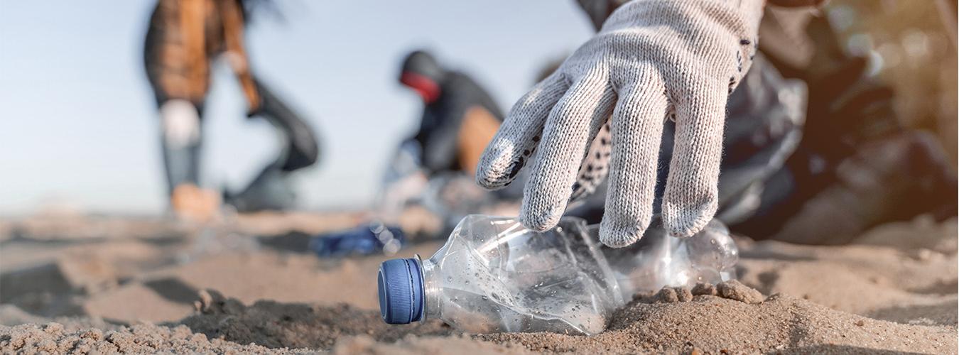 cleaning crew of plastic in the beach